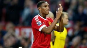 Manchester United's Anthony Martial applauds the crowd after the English Premier League soccer match between Manchester United and Liverpool at Old Trafford Stadium, Manchester, England, Saturday, Sept. 12, 2015. (AP Photo/Jon Super)
